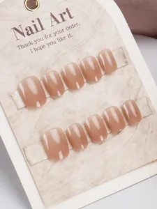 Detailed macro view of 10-piece short square nude pink gradient press-on nail set
