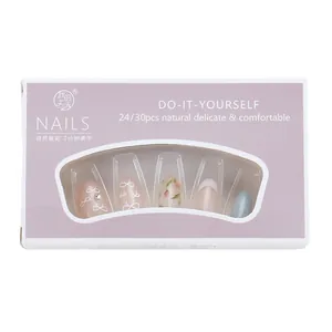 Press-on nail set featuring white bows and floral patterns in light pink and blue