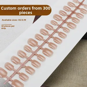 Short nude pink glossy press-on nails in sizes XS/S/M with 30 pieces per strip