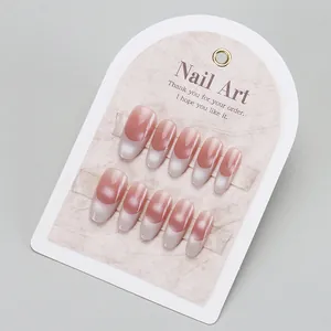 Pink and white gradient cat-eye press-on nails set on display card with 10 pieces