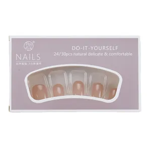 Short French blush press-on nails in pink with a purple window display box packaging