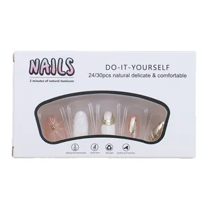 Reusable press-on nails set featuring nude floral, white patterns, and gold stripe accents