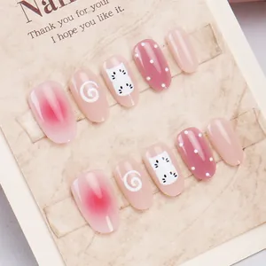 Uñas postizas artesanales degradado rosa con lindos patrones de gato y espirales blancas