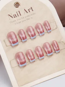 Macro detail of coffin-shaped pink cat-eye nails with light blue french tips