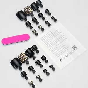 Faux ongles de pieds noirs brillants avec strass dorés et lime à ongles incluse