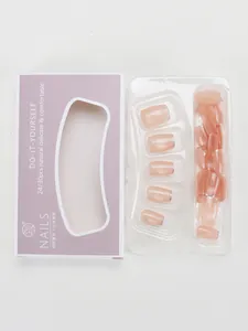 Short nude pink press-on nails set with silver glitter tips in lavender packaging