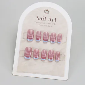 Blue French tip cat-eye press-on nails set in short square shape on display card