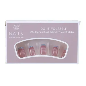 Light purple cat eye press-on nails with blue French tips in paper packaging box