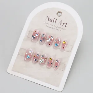 Pink press-on nail set with colorful heart rhinestones and sparkling crystal gems