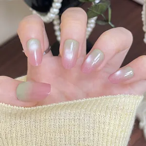 Pink and green gradient cat eye press-on nails with almond shape and shimmer finish