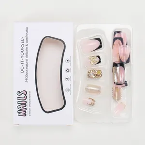 Press-on nails set with black French tips, pink base, glitter and metal bows ornaments