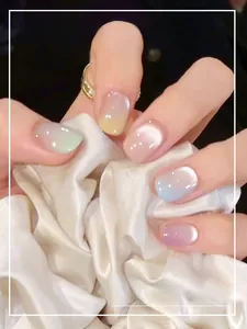 Macro detail of cat-eye gradient press-on nails with shiny macaron color finish