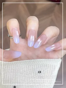 Close-up of elegant gradient mauve cat-eye press-on nails with a glossy jelly finish