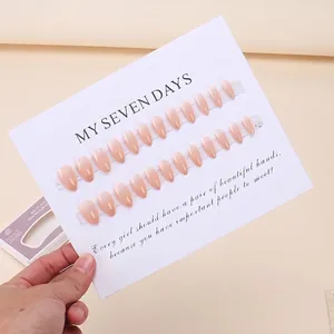 24-piece gradient nude pink press-on nails in ballerina shape with display packaging