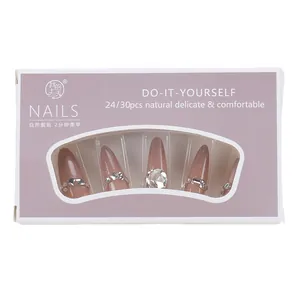 Faux ongles œil de chat rose scintillant avec strass et forme amande allongée
