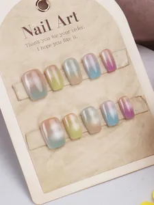 Detail of macaron gradient cat-eye press-on nails in short square shape on display card