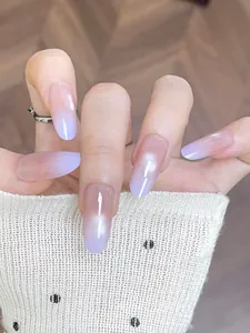 Macro detail of almond-shaped cat eye press-on nails with purple gradient finish