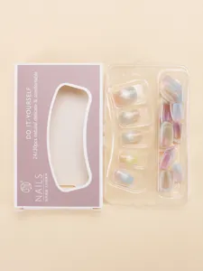 Close-up of macaron gradient cat-eye press-on nails in purple and white gift packaging