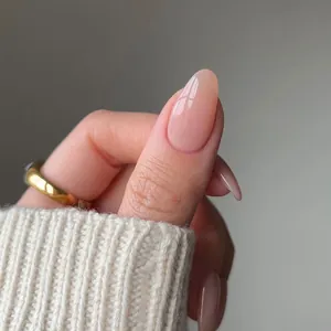 Elegant nude pink gradient press-on nails in oval shape with a glossy mirror finish
