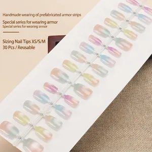 Cat-eye press-on nails with gradient candy colors set on a white display board