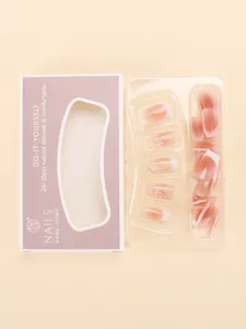 Detail of nude gradient press-on nails with silver butterfly bows and french tips