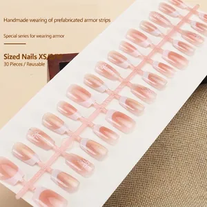 Handmade pink gradient butterfly press-on nails with white French tips and 3D bow design