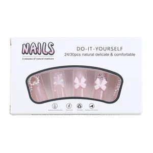 Pink press-on nails set with elegant pearls, rhinestones and decorative 3D bows