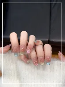 Macro detail of long coffin press-on nails with blue-purple gradient and glitter finish