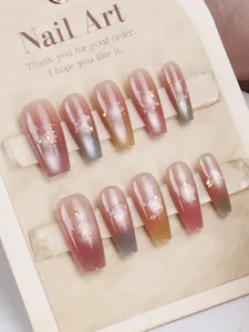 Detail of coffin-shaped press-on nails with purple and blue gradient smudge and glitter