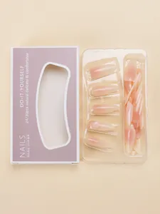 Detail of gradient nude pink press-on nails in purple DIY retail packaging box