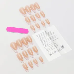 Flat lay of 24pcs nude French false nails set with mini file and adhesive instructions
