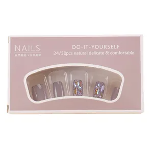 Handmade short press-on nails with colorful aurora glitter in luxury gift packaging