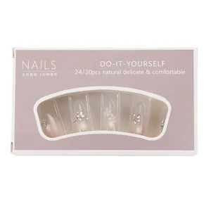 Press-on nails with nude gradient, 3D white flowers and rhinestones in purple window box