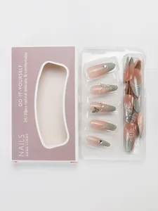 Detailed view of handmade press-on nails with 3D metal butterfly and gradient cat eye finish