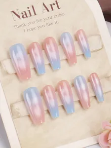 Detail of pink and blue gradient cat-eye coffin press-on nails with shimmering glitter finish