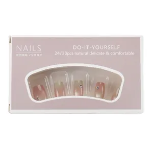 Pink and green gradient press-on nail kit with rhinestones in a display box