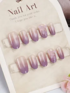 Detailed macro view of purple cat-eye gradient press-on nails with 3D bow accents