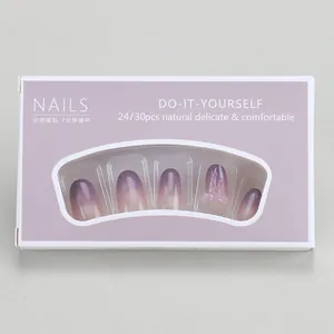 Detail of purple cat-eye press-on nails set with gradient design and 3D bow accents