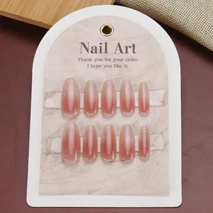 Pink gradient cat eye press-on nails with a glossy jelly finish and long oval shape