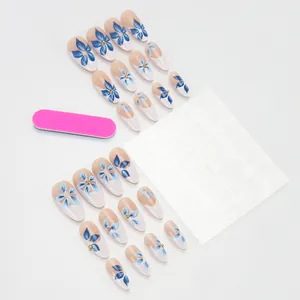 French tip press-on nails set with vintage blue flowers and gold bead accents