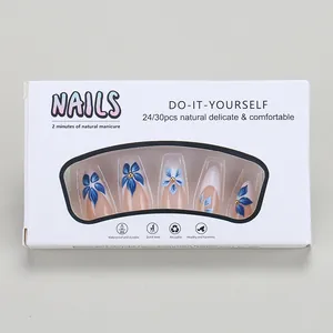 Detail of 24pcs long coffin press on nails featuring blue floral art and pink base