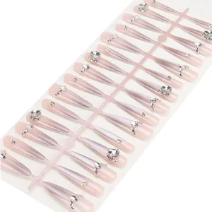 Sparkly handmade ombre nude press-on nails with luxury rhinestones in almond shape