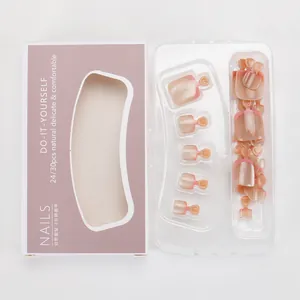 French tip press-on toenails in nude pink gradient with red edges and packaging
