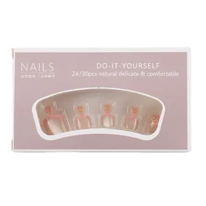 Nude press-on toenails with pink french tips in professional display packaging box