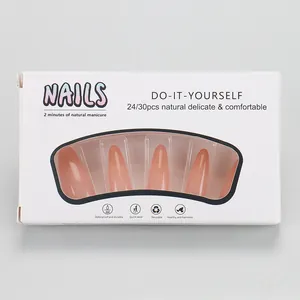 Macro view of nude pink gradient waterdrop nails showing the 24/30 piece kit packaging