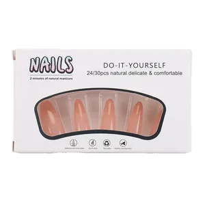 Long stiletto press-on nails in nude pink gradient with a white window display box