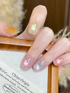 Short square press-on nails with transparent jelly texture and orange polka dot patterns
