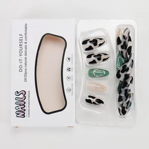 Press-on nail set with cow print, 3D metallic stars, and green retro accents