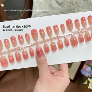Short oval press-on nails with peach pink gradient finish, 30 pieces reusable set