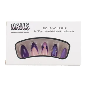 Purple and pink press-on nails with gold accents in a 24-piece professional set